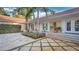 Backyard patio with stone flooring and lush landscaping at 2300 N Scenic Hwy # 104, Lake Wales, FL 33898