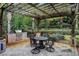 Covered patio features an outdoor kitchen and dining set at 2300 N Scenic Hwy # 104, Lake Wales, FL 33898