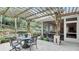 Relaxing pergola-covered patio with seating and lush landscaping at 2300 N Scenic Hwy # 104, Lake Wales, FL 33898