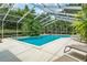 Relaxing screened pool area with lounge chairs at 2300 N Scenic Hwy # 104, Lake Wales, FL 33898