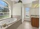 Bathroom with a large soaking tub and walk-in shower at 231 Terranova Blvd, Winter Haven, FL 33884