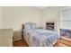 Bedroom with light blue bedding and wicker furniture at 231 Terranova Blvd, Winter Haven, FL 33884