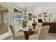 Bright breakfast nook with glass-top table and view of the backyard at 231 Terranova Blvd, Winter Haven, FL 33884