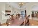 Formal dining room with hardwood floors and a large glass table at 231 Terranova Blvd, Winter Haven, FL 33884