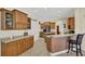 Kitchen with island, breakfast bar and plenty of cabinet space at 231 Terranova Blvd, Winter Haven, FL 33884