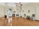 Spacious living room with hardwood floors, high ceilings, and ample natural light at 231 Terranova Blvd, Winter Haven, FL 33884