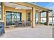 Covered patio with seating area, ceiling fans, and sliding glass doors at 231 Terranova Blvd, Winter Haven, FL 33884