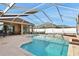 Large screened-in pool with a patio and a view of the backyard at 231 Terranova Blvd, Winter Haven, FL 33884