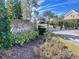 Gated community entrance with a stone sign and lush landscaping at 3155 Stonewater Dr # 3155, Lakeland, FL 33803