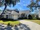 Gray two-story home with a driveway and landscaping at 3155 Stonewater Dr # 3155, Lakeland, FL 33803