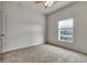 Well-lit bedroom with ceiling fan and window at 3803 Wind Dancer Cir, Saint Cloud, FL 34772