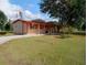 Single-story home with a carport and spacious yard at 4022 Carter Ct, Polk City, FL 33868