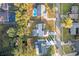 Aerial view of home with pool and solar panels, next to road at 4210 Old Colony Rd, Mulberry, FL 33860