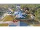 Aerial view of house, pool, and large backyard in quiet neighborhood at 4210 Old Colony Rd, Mulberry, FL 33860