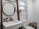 Clean bathroom with a white tiled shower and modern vanity at 4210 Old Colony Rd, Mulberry, FL 33860