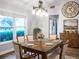 Farmhouse-style dining room with a wooden table and statement clock at 4210 Old Colony Rd, Mulberry, FL 33860