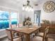 Spacious dining room, featuring a rustic wooden table and a large clock at 4210 Old Colony Rd, Mulberry, FL 33860