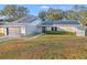 House exterior showcasing solar panels and landscaped yard at 4210 Old Colony Rd, Mulberry, FL 33860