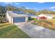 Single story home with solar panels and attached garage at 4210 Old Colony Rd, Mulberry, FL 33860
