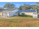 Single story home with solar panels, showcasing front entrance at 4210 Old Colony Rd, Mulberry, FL 33860