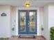 Double front doors with glass panels and decorative accents at 4210 Old Colony Rd, Mulberry, FL 33860