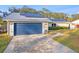 Home with attached garage, solar panels, and walkway at 4210 Old Colony Rd, Mulberry, FL 33860