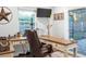 Spacious home office with a large desk and comfortable chair at 4210 Old Colony Rd, Mulberry, FL 33860