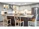 Kitchen island with granite countertop and seating for four at 4210 Old Colony Rd, Mulberry, FL 33860