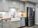 Renovated kitchen with white farmhouse sink and stainless steel appliances at 4210 Old Colony Rd, Mulberry, FL 33860