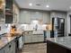 Modern kitchen featuring a farmhouse sink and shaker cabinets at 4210 Old Colony Rd, Mulberry, FL 33860