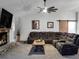 Open living room with sectional sofa, fireplace, and barn door at 4210 Old Colony Rd, Mulberry, FL 33860