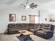 Spacious living room featuring a large sectional sofa and wood coffee table at 4210 Old Colony Rd, Mulberry, FL 33860