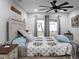Main bedroom featuring a king-size bed and backyard views at 4210 Old Colony Rd, Mulberry, FL 33860