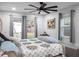 Main bedroom with a king-size bed and backyard access at 4210 Old Colony Rd, Mulberry, FL 33860