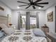 Bright main bedroom with king-size bed and sliding glass doors at 4210 Old Colony Rd, Mulberry, FL 33860