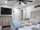 Spacious main bedroom with king-size bed and large TV at 4210 Old Colony Rd, Mulberry, FL 33860