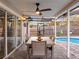 Inviting pool area with patio furniture and screened enclosure at 4210 Old Colony Rd, Mulberry, FL 33860