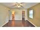 Bedroom with wood floors, ceiling fan and ensuite bath at 4504 Crystal Beach Rd, Winter Haven, FL 33880