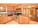 Kitchen boasts stainless steel appliances and wood cabinets at 4504 Crystal Beach Rd, Winter Haven, FL 33880