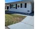 Single story home with carport and landscaped lawn at 4936 Goldenview Ln, Lakeland, FL 33811