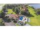 Community pool, tennis courts and clubhouse next to lake at 603 Sweet Bay Cir # 603, Winter Haven, FL 33884