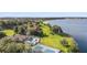 Aerial view of community with lakefront access and tennis courts at 603 Sweet Bay Cir # 603, Winter Haven, FL 33884