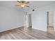 Bedroom with wood-look floors and access to bathroom at 603 Sweet Bay Cir # 603, Winter Haven, FL 33884