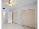 Spacious bedroom with double closets and ceiling fan at 603 Sweet Bay Cir # 603, Winter Haven, FL 33884