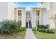 Condo building exterior with walkway and landscaping at 603 Sweet Bay Cir # 603, Winter Haven, FL 33884