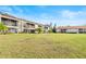 Condo building with a large grassy area at 603 Sweet Bay Cir # 603, Winter Haven, FL 33884