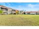 Back view of condo building with grassy lawn at 603 Sweet Bay Cir # 603, Winter Haven, FL 33884