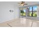 Living room with tile floors and sliding glass doors at 603 Sweet Bay Cir # 603, Winter Haven, FL 33884