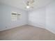 Spacious bedroom with tile floors and window shutters at 723 Canberra Rd, Winter Haven, FL 33884