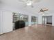 Gathering room with pool and patio view, tile floor, and ceiling fan at 723 Canberra Rd, Winter Haven, FL 33884